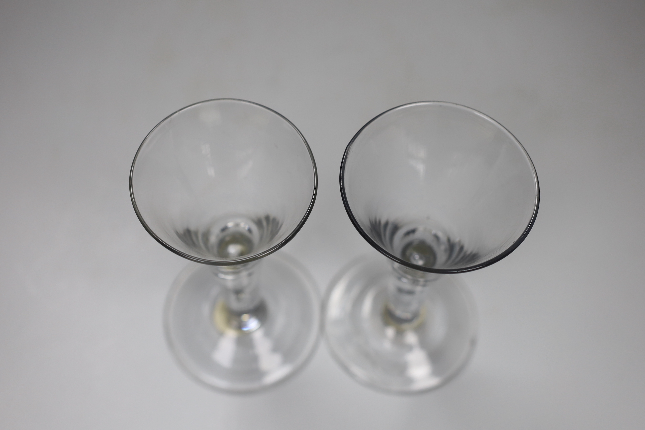 Two George II drawn trumpet wine glasses, each with air-tear, tallest 16cm